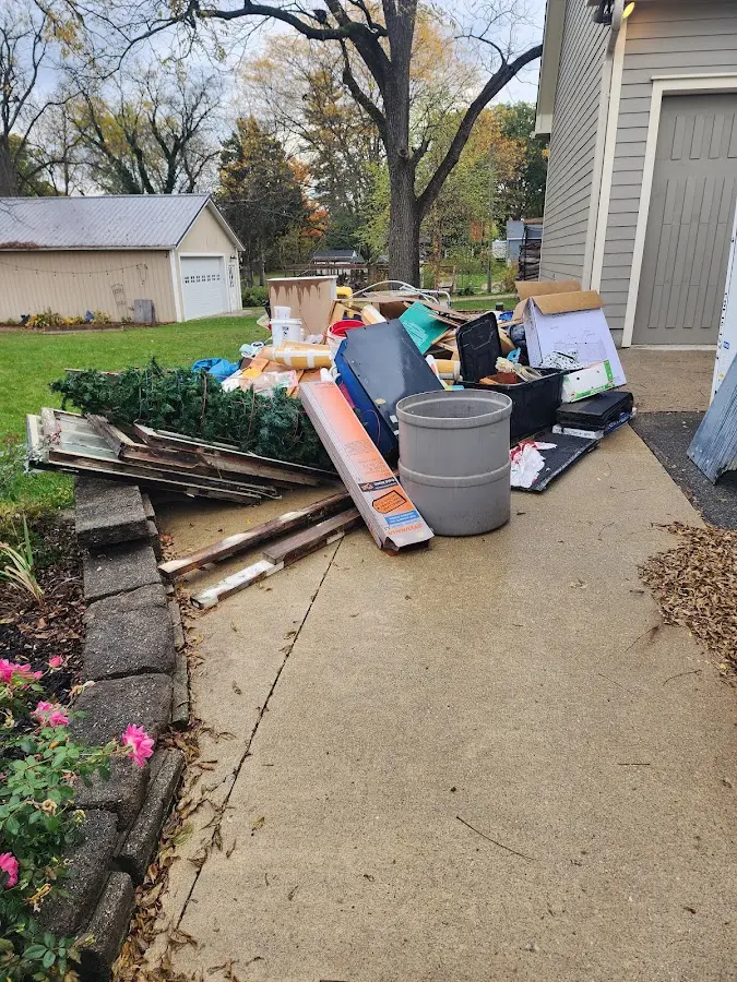 Dumpster being loaded with debris for Roofing Dumpster Rental in Wills Point